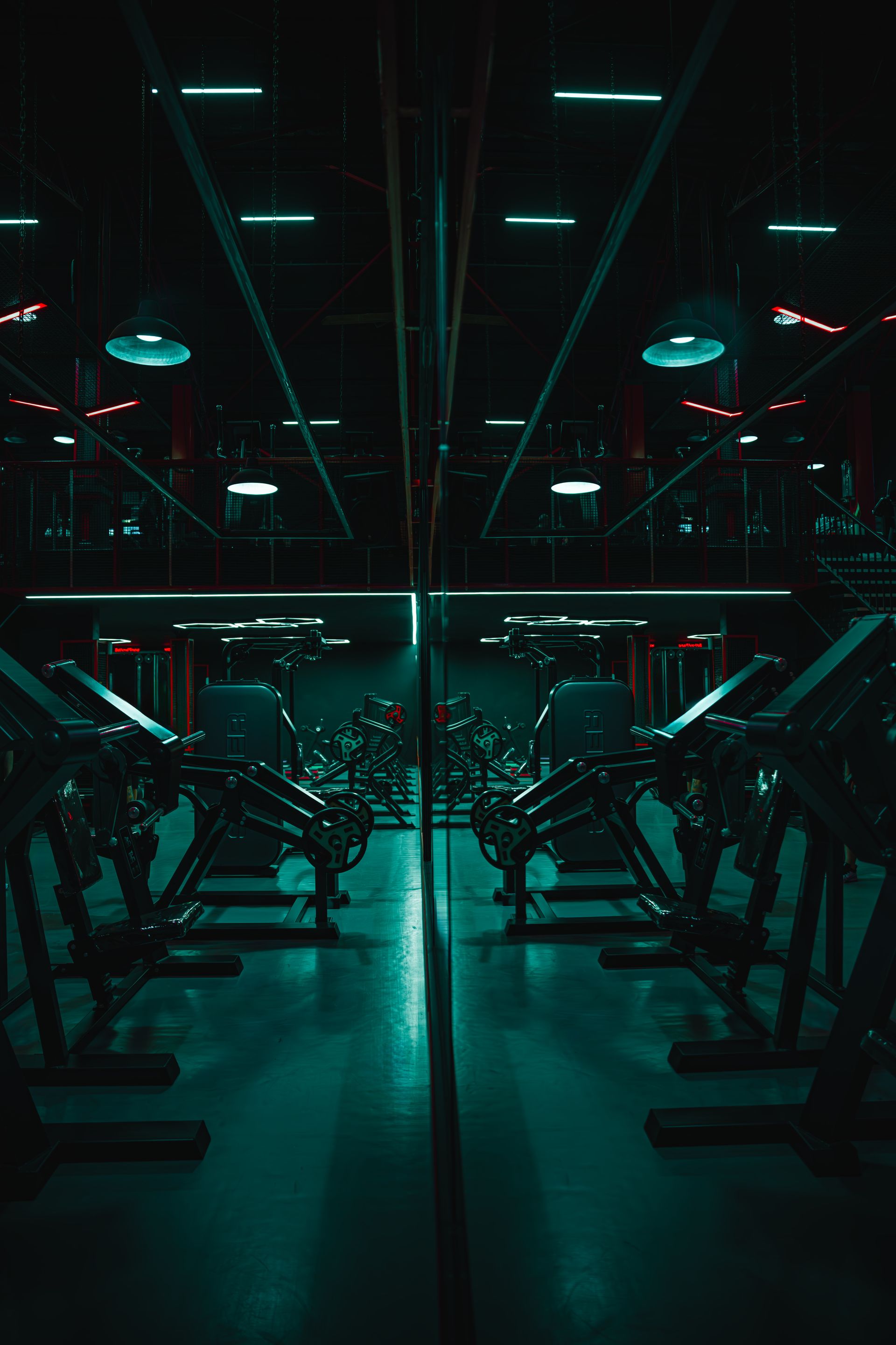Strength training session in a dark gym, warm light on the lifter